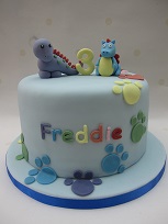 dinosaur and dragon birthday cake